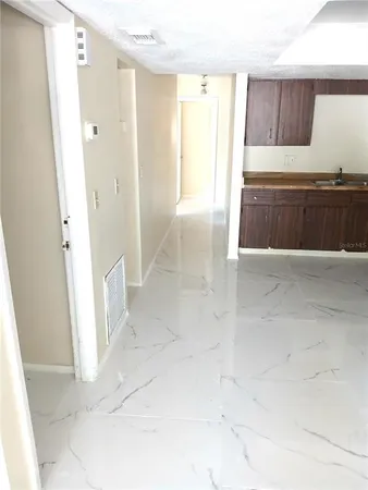 a view of entryway with kitchen