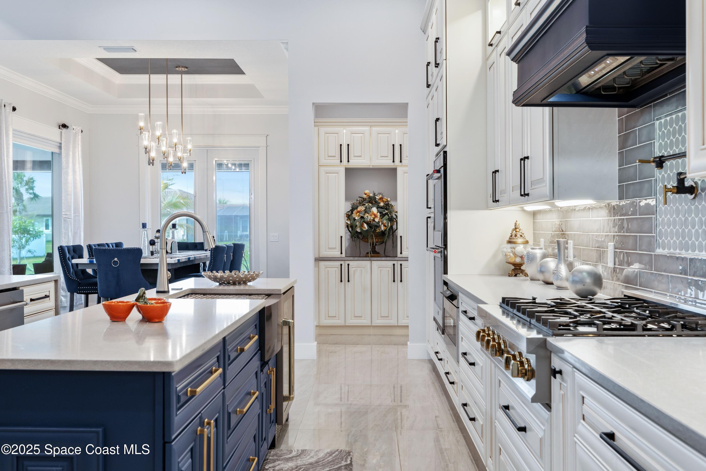 1420 Corey Road Malabar, FL 32950 - Photo 13 of 35 a kitchen that has a lot of cabinets
