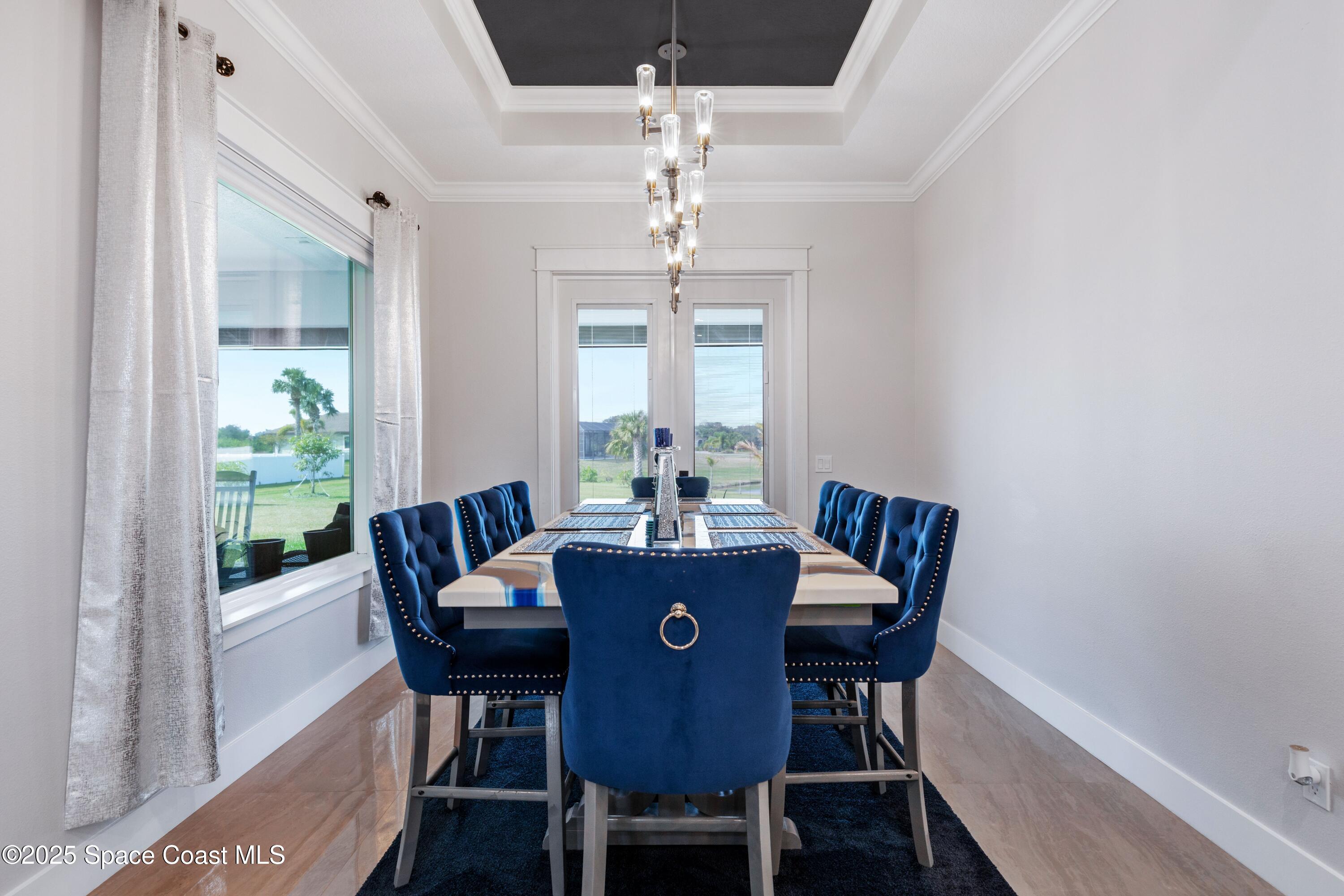 1420 Corey Road Malabar, FL 32950 - Photo 14 of 35 a view of a dining room with furniture window and outside view