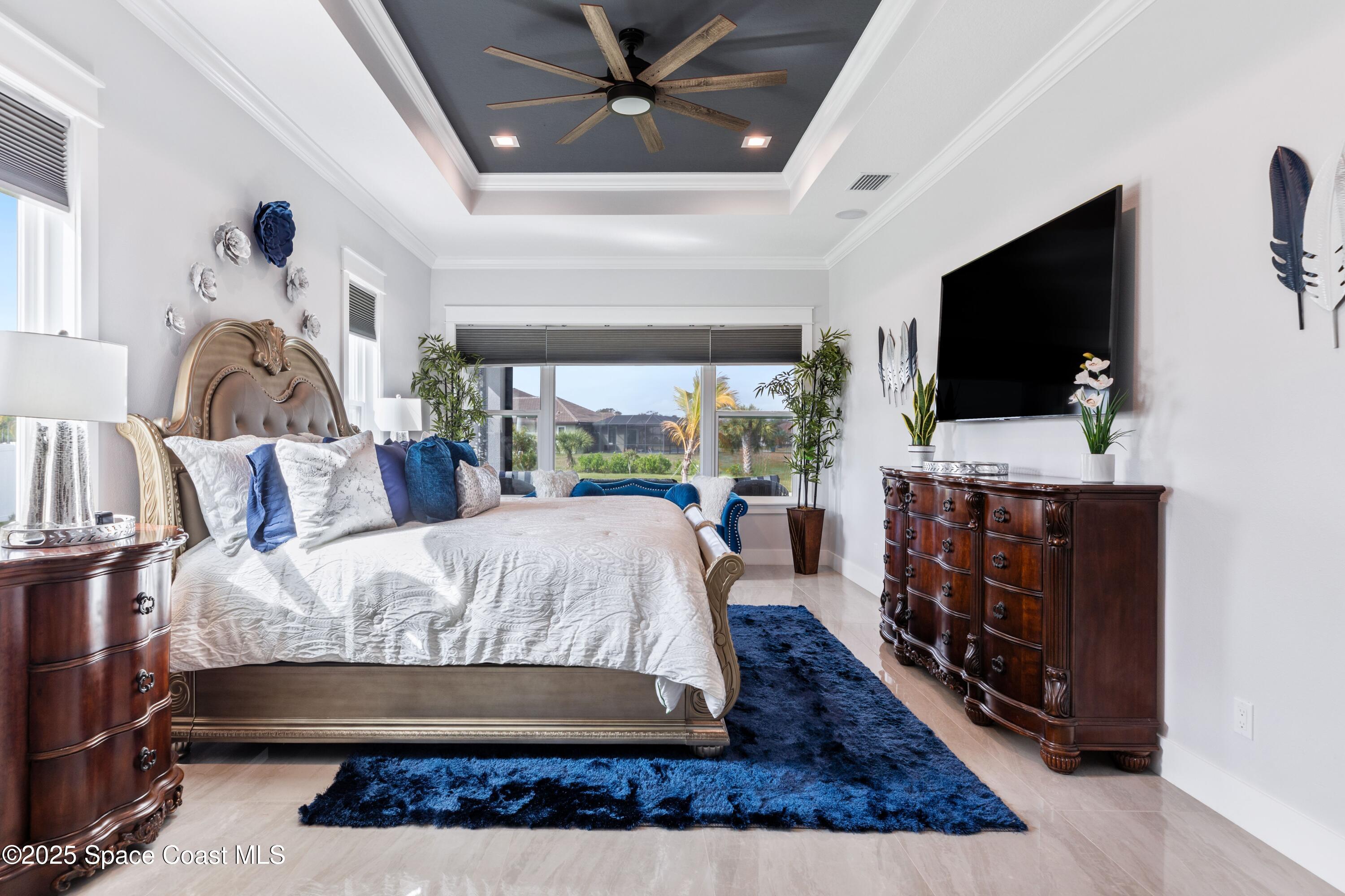 1420 Corey Road Malabar, FL 32950 - Photo 19 of 35 a living room with furniture and a flat screen tv