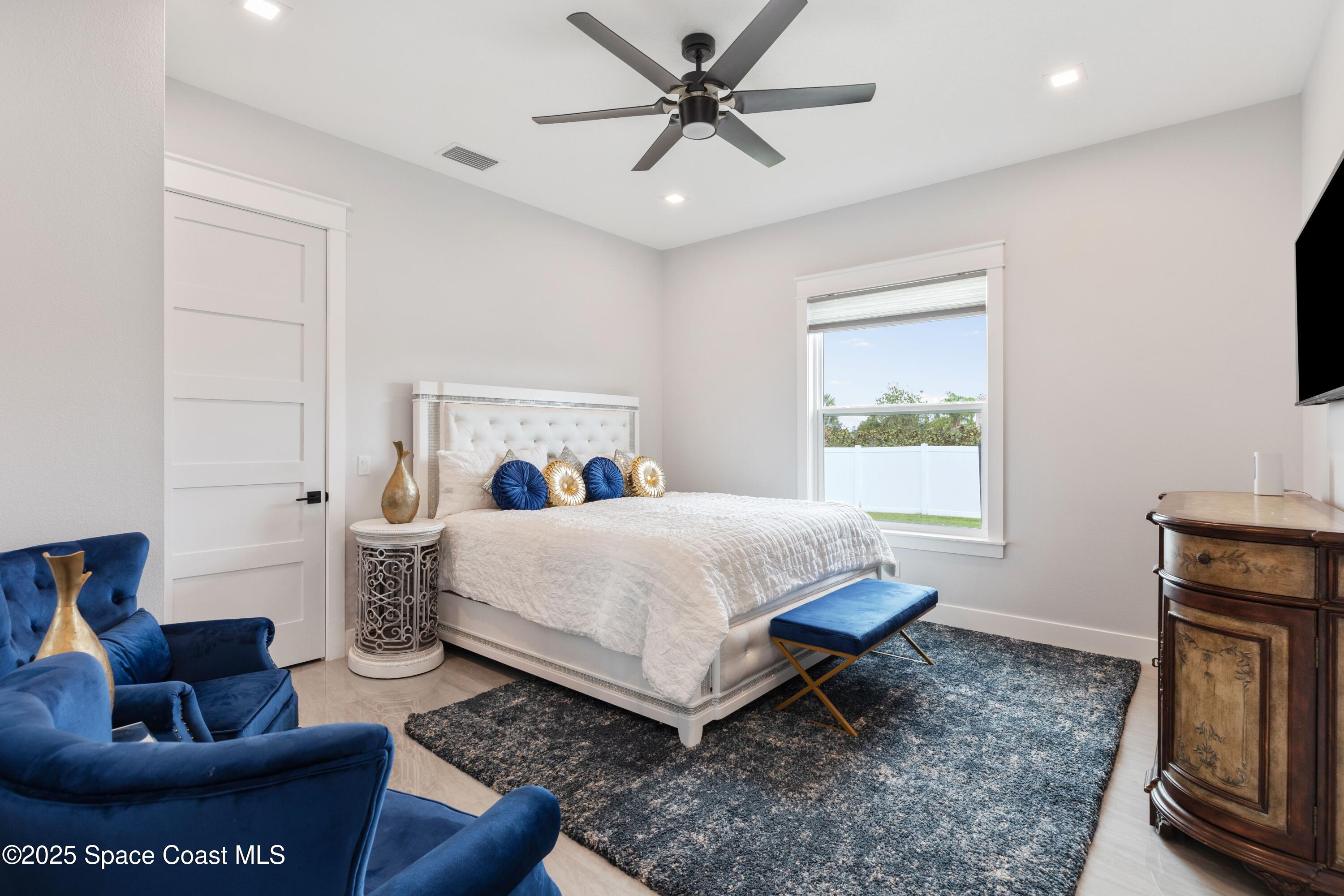 1420 Corey Road Malabar, FL 32950 - Photo 23 of 35 a bed room with a bed and a couch