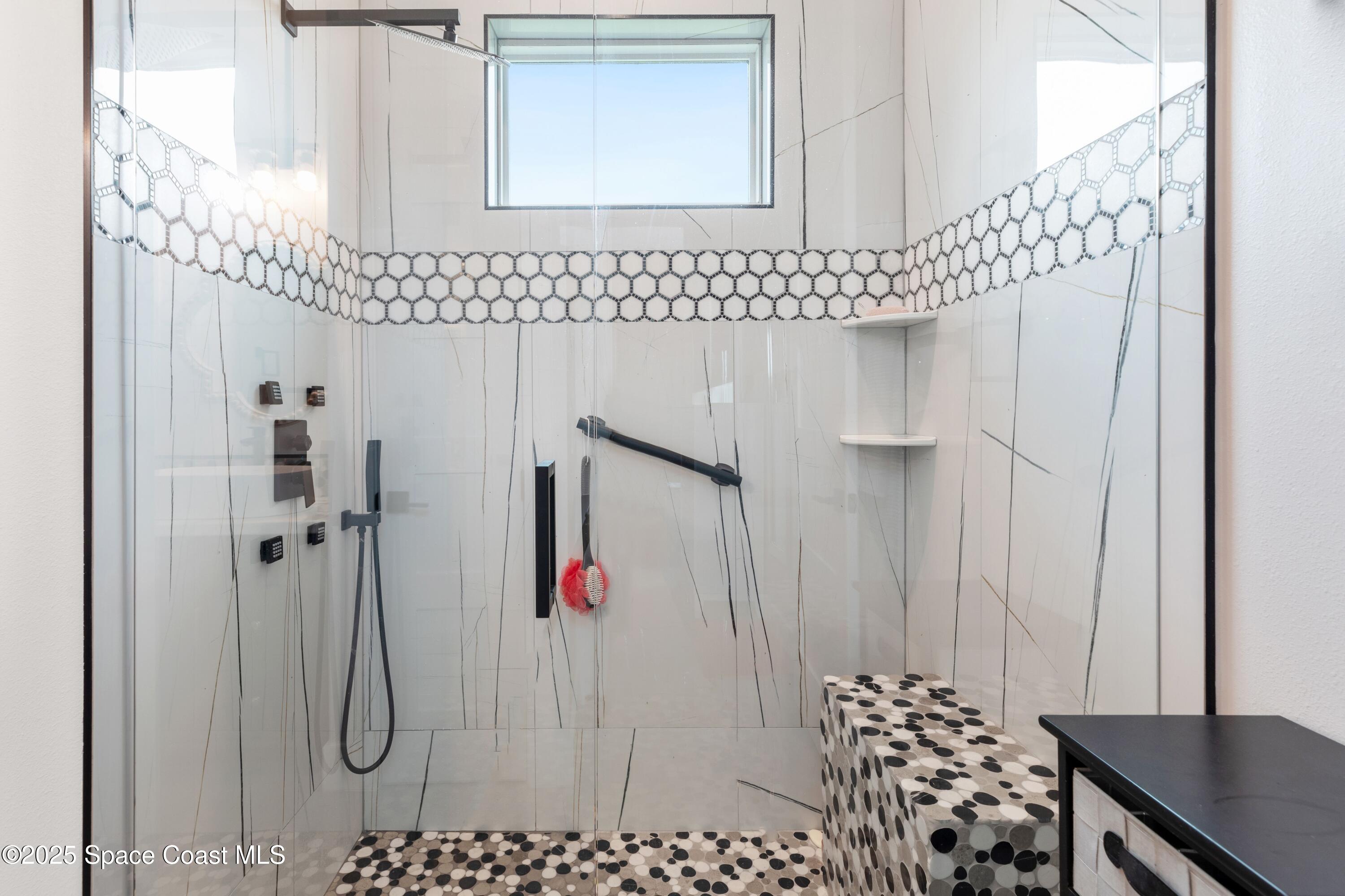 1420 Corey Road Malabar, FL 32950 - Photo 26 of 35 a bathroom with a shower