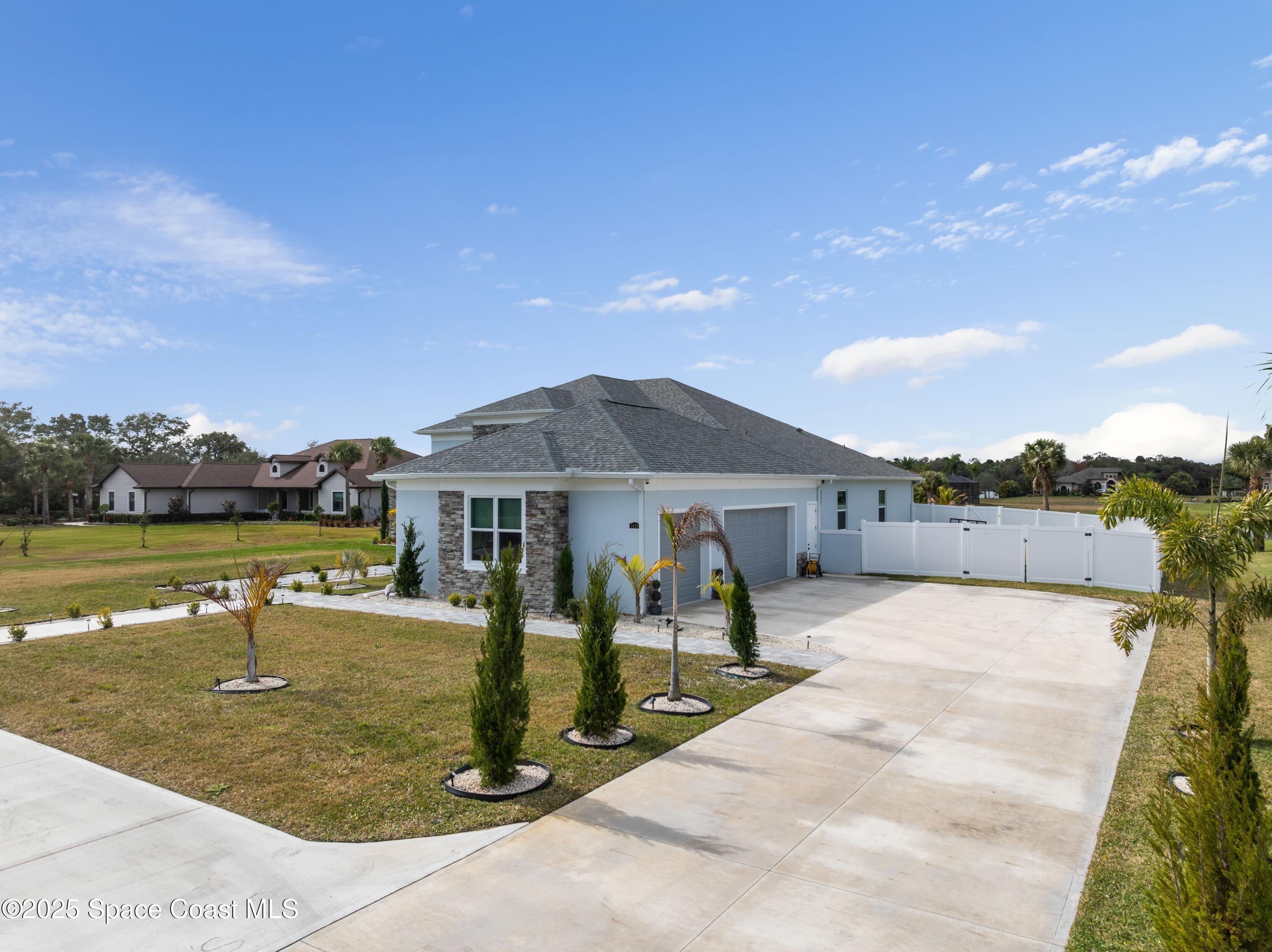 1420 Corey Road Malabar, FL 32950 - Photo 32 of 35 a view of a house with yard and sitting area
