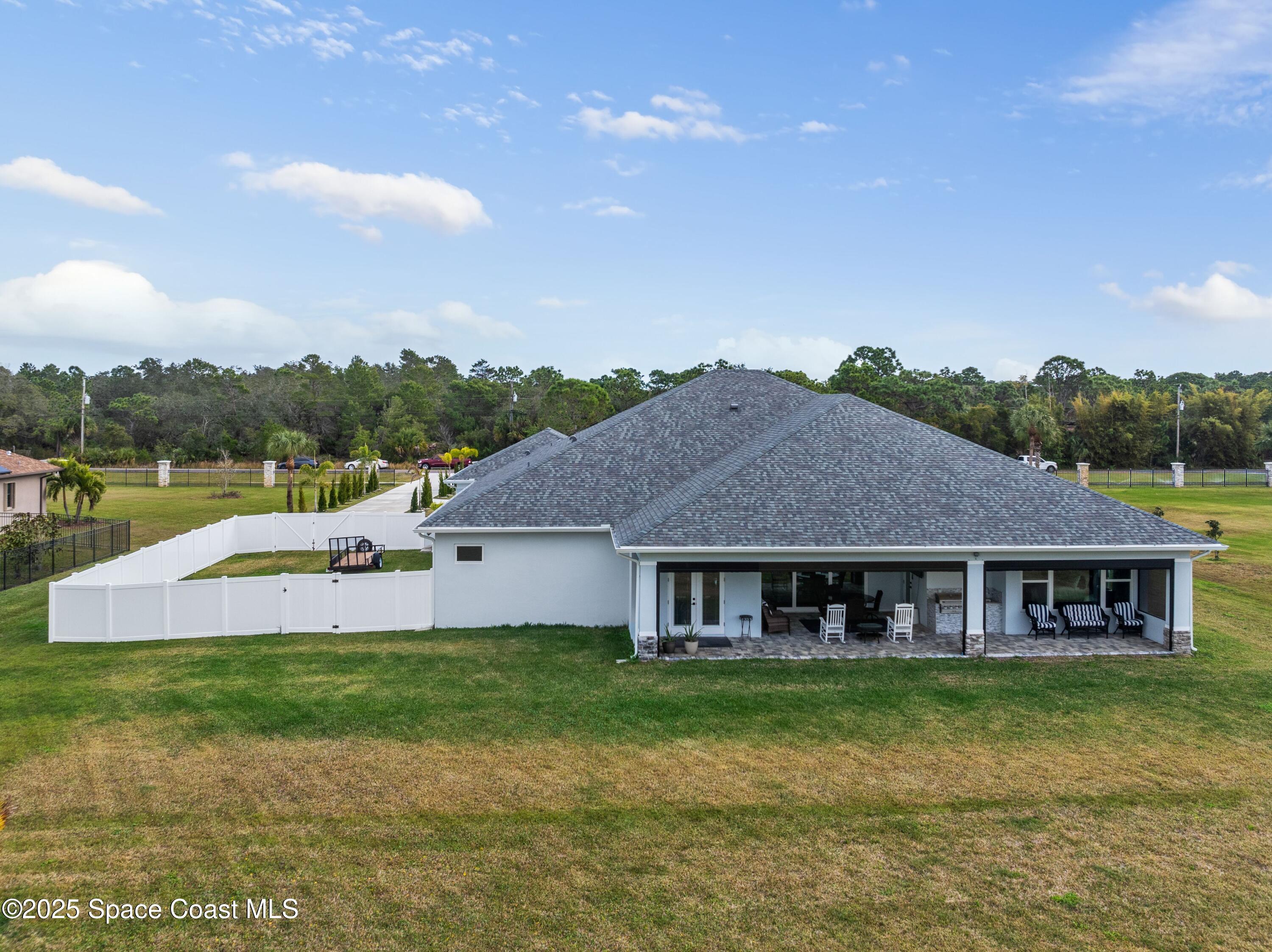 1420 Corey Road Malabar, FL 32950 - Photo 33 of 35 a view of a house with a yard and sitting area