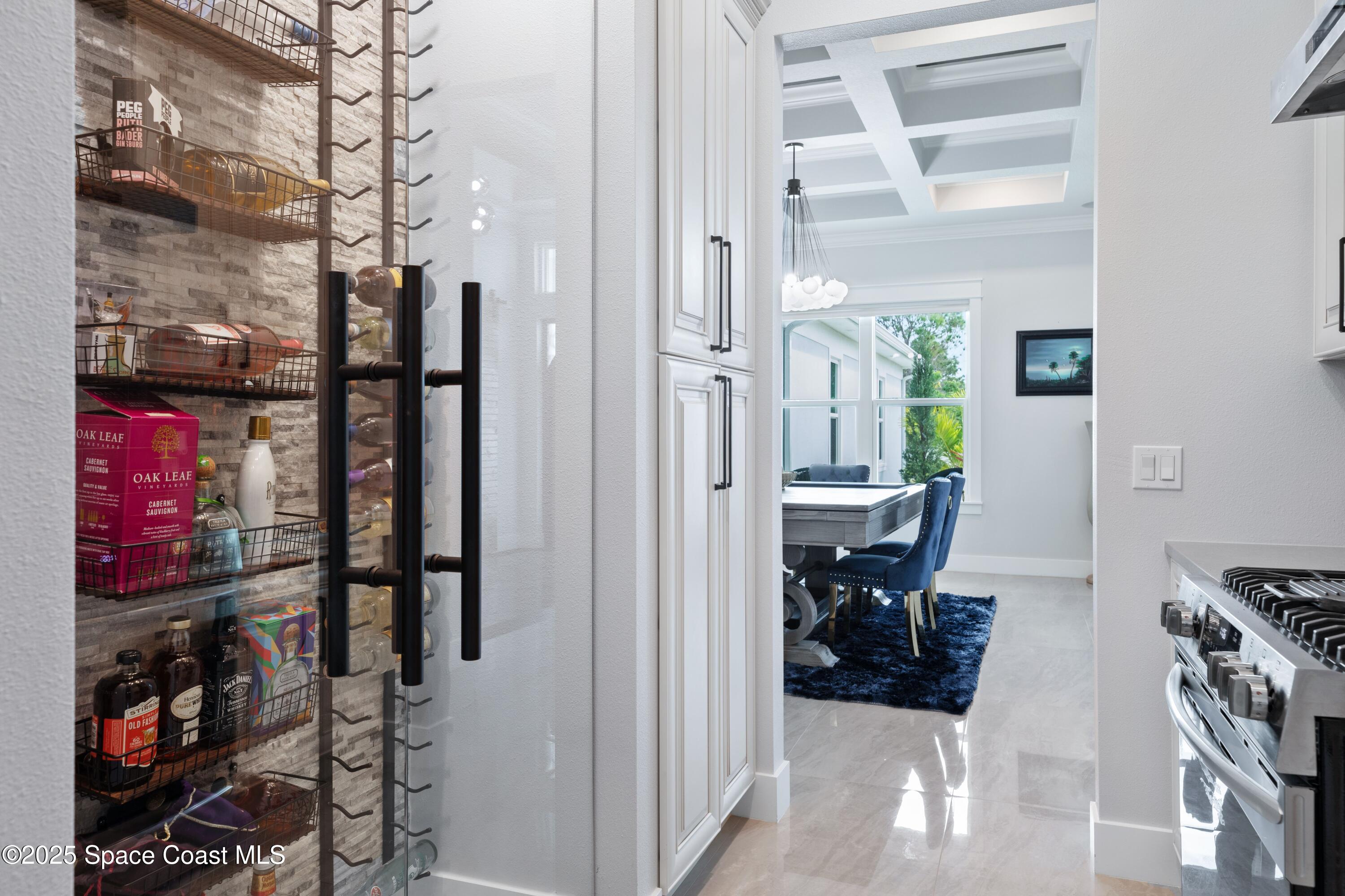 1420 Corey Road Malabar, FL 32950 - Photo 7 of 35 a view of walk in closet with clothes and shoes
