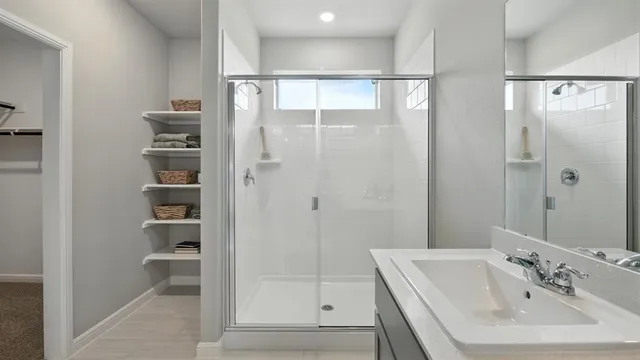 a bedroom with a bed and ceiling fan