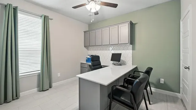 a view of kitchen with cabinets and wooden floor
