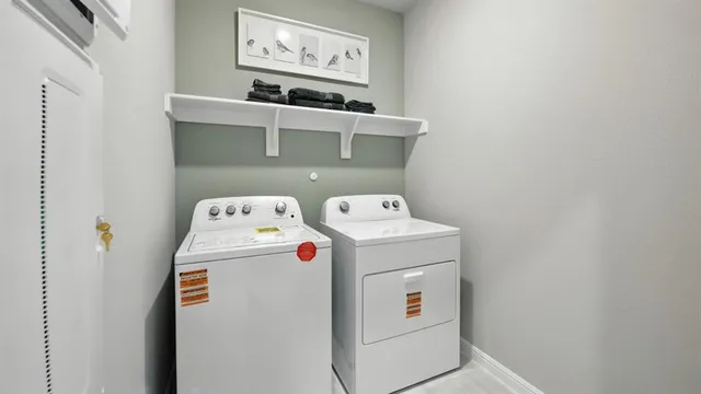 a view of a dining room with furniture and a chandelier