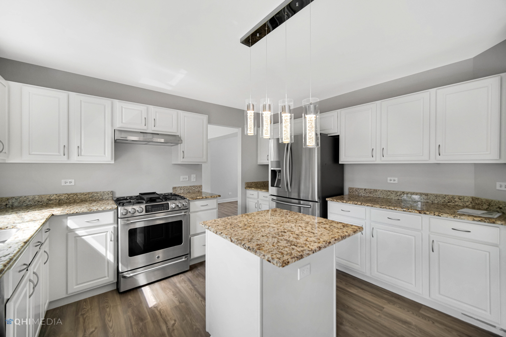 3101 Bennett Place Aurora, IL 60502 - Photo 12 of 30 a kitchen with granite countertop a sink stove and refrigerator