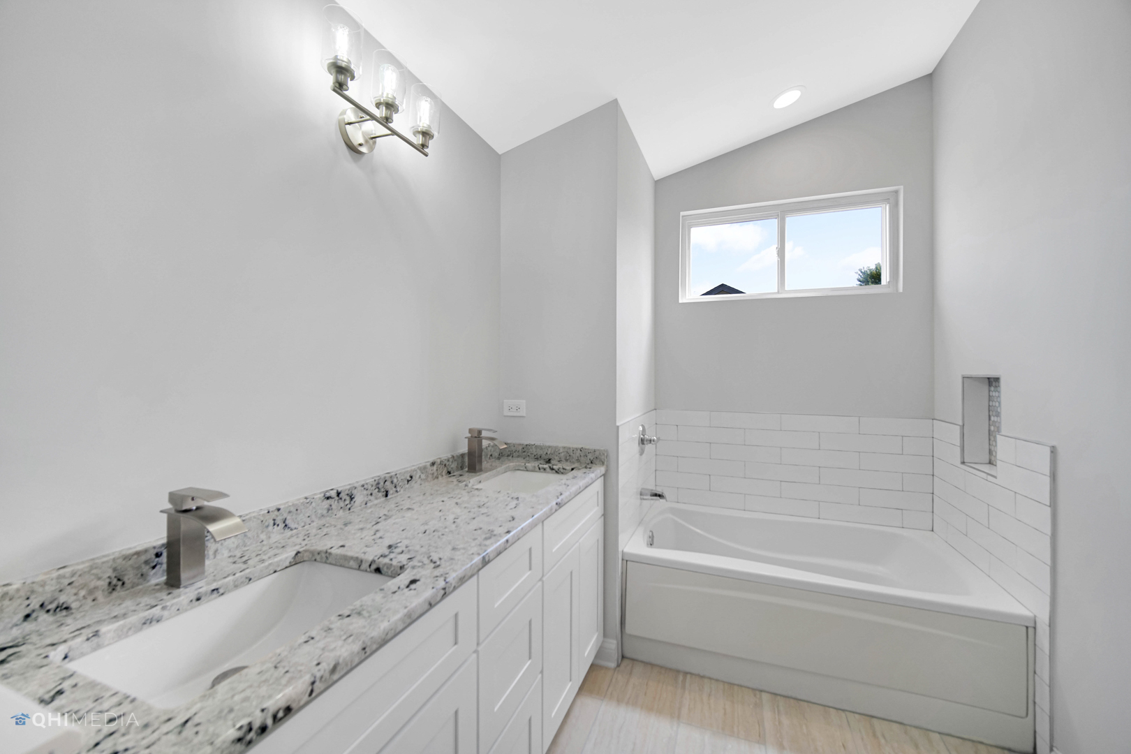 3101 Bennett Place Aurora, IL 60502 - Photo 25 of 30 a bathroom with a granite countertop sink and mirror with bathtub
