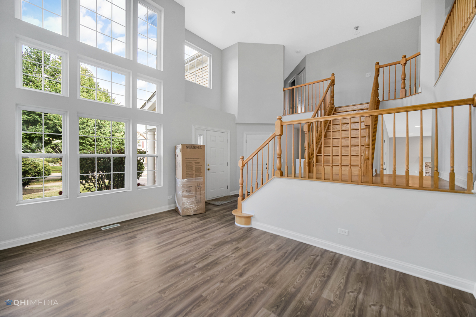 3101 Bennett Place Aurora, IL 60502 - Photo 7 of 30 a view of an empty room with wooden floor and a window