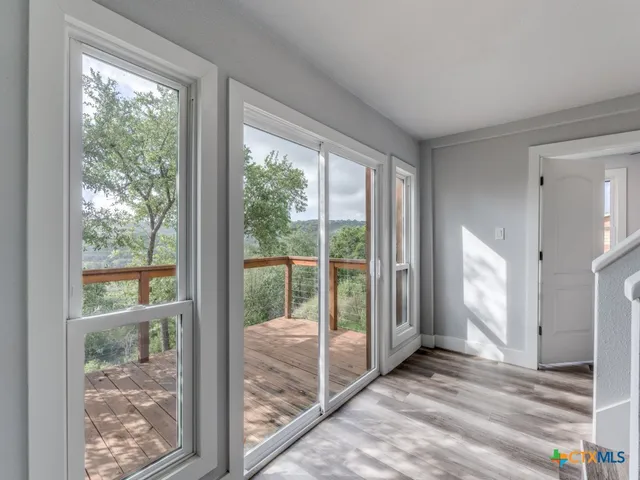 a view of a room that has a large window