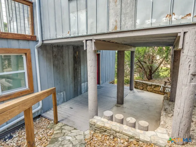 a view of an empty room with a balcony