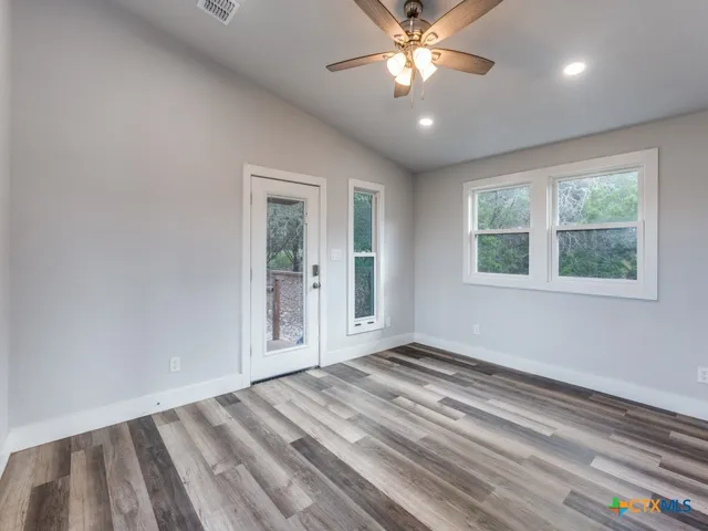 a view of an empty room with a window