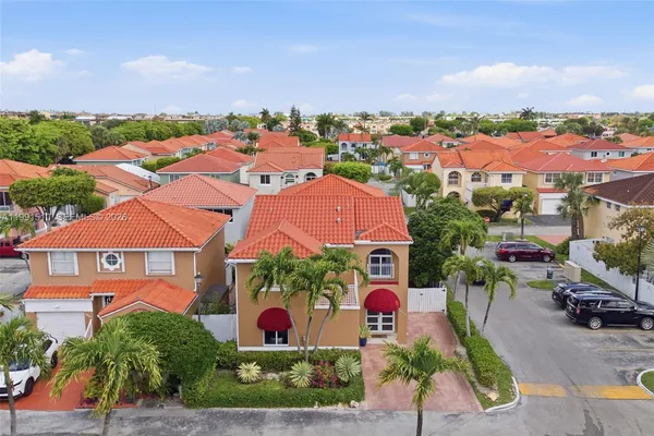 an aerial view of residential houses and outdoor space