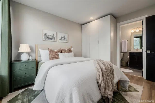 a bedroom with a bed and a view of bathroom