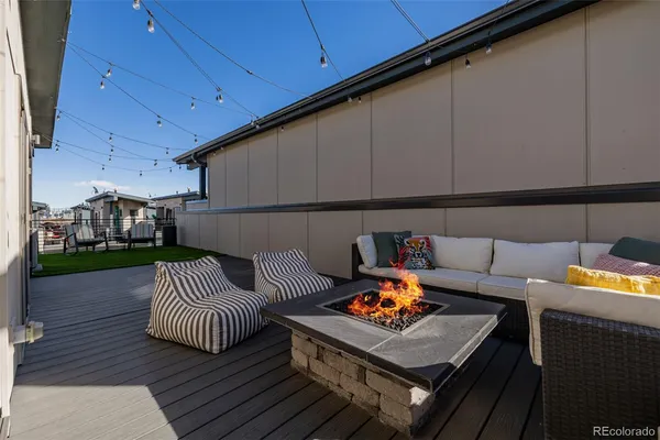 a outdoor living space with furniture and a fireplace