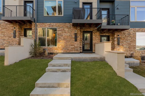 a view of a brick house with many windows