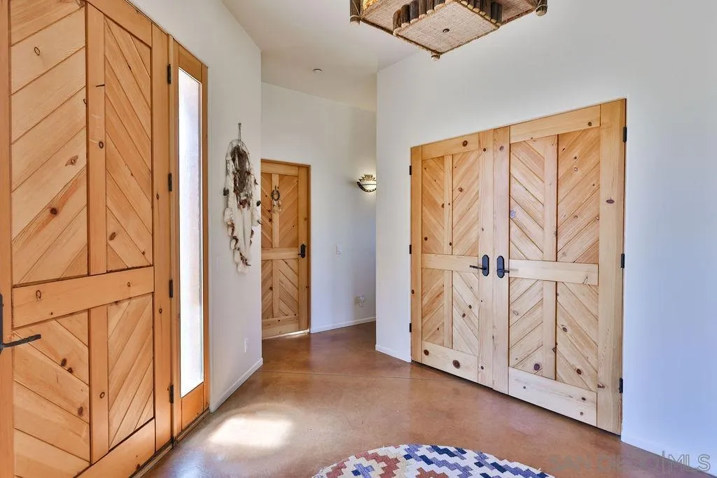 15775 Castle Peak Lane Jamul, CA 91935 - Photo 36 of 56 an entryway with wooden floor and cabinet