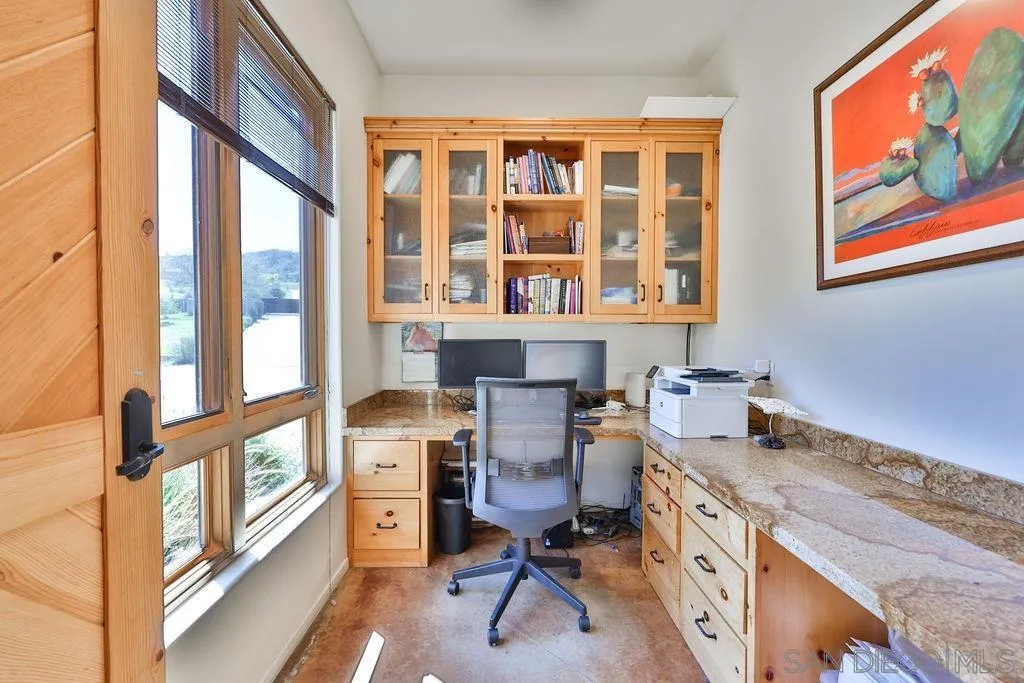 15775 Castle Peak Lane Jamul, CA 91935 - Photo 37 of 56 a view of a workspace with furniture and a window