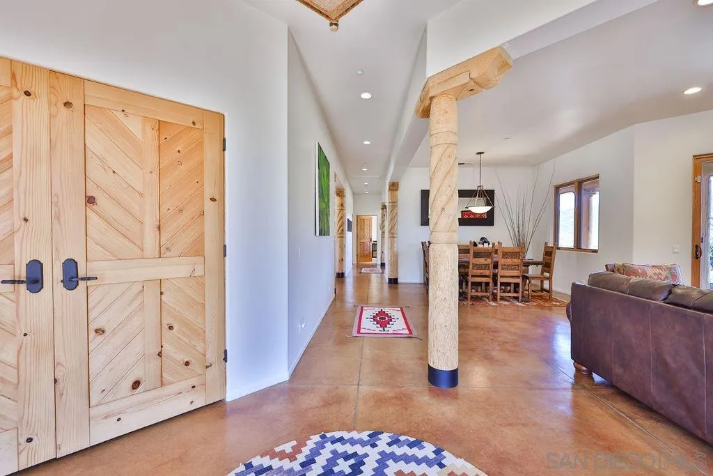 15775 Castle Peak Lane Jamul, CA 91935 - Photo 9 of 56 a living room with furniture and wooden floor