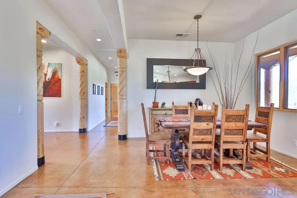 15775 Castle Peak Lane Jamul, CA 91935 - Photo 10 of 56 a view of a dining room with furniture and chandelier