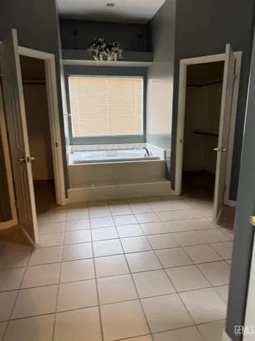 a bathroom with a vanity and a bathtub