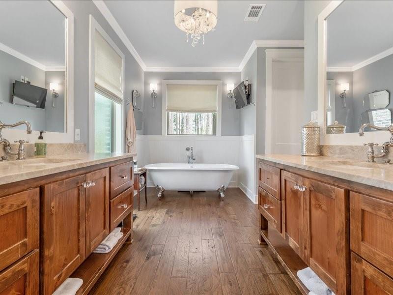 8595 Toler Pointe Larue, TX 75770 - Photo 27 of 40 Custom cabinets lead to Cast Iron Bathtub surrounded by bead board.