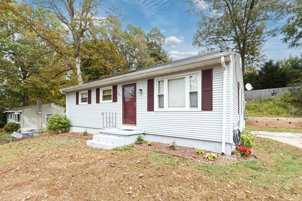 a front view of a house with a yard