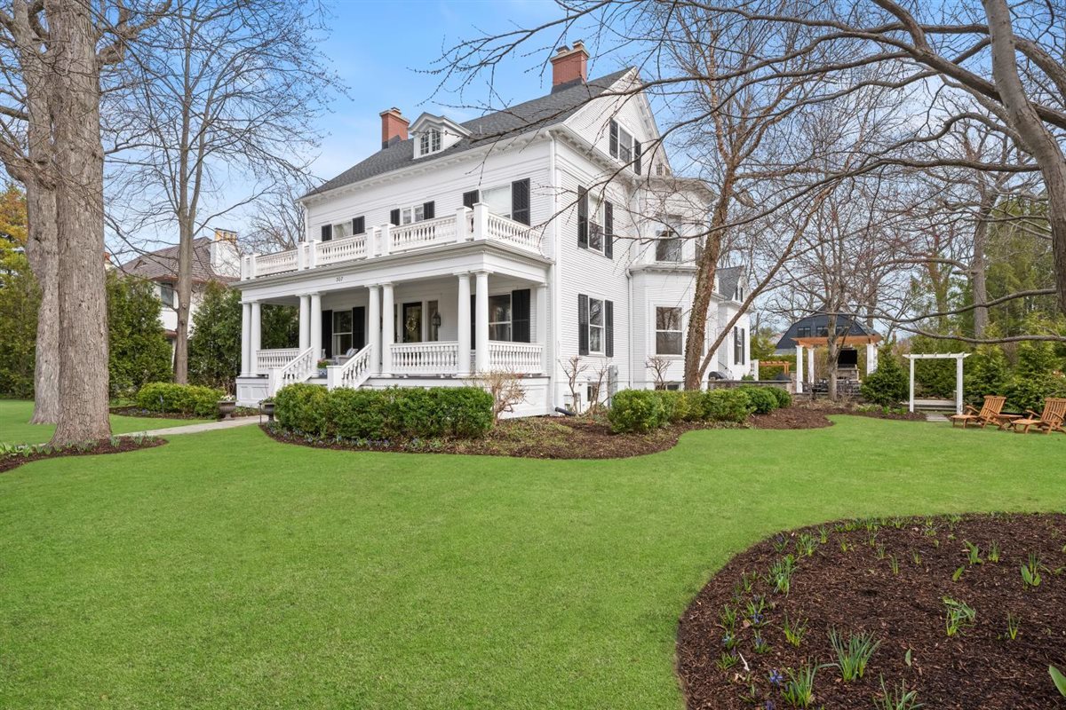 307 Abbotsford Road Kenilworth, IL 60043 - Photo 1 of 57 a front view of a house with a garden and trees