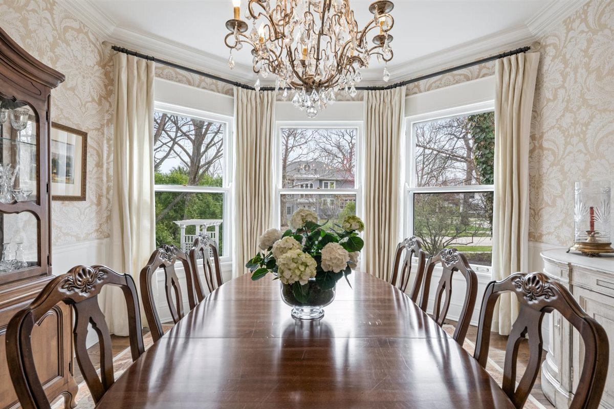 307 Abbotsford Road Kenilworth, IL 60043 - Photo 12 of 57 a view of a dining room with furniture window and wooden floor