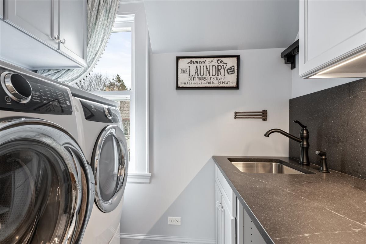 307 Abbotsford Road Kenilworth, IL 60043 - Photo 29 of 57 a close view of a sink and washer and dryer