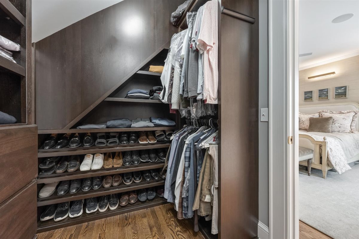 307 Abbotsford Road Kenilworth, IL 60043 - Photo 31 of 57 a view of walk in closet with clothes and shoes