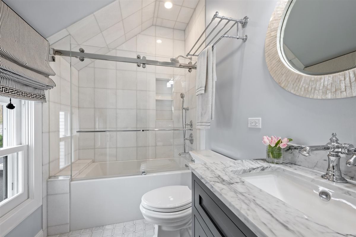 307 Abbotsford Road Kenilworth, IL 60043 - Photo 33 of 57 a bathroom with a granite countertop toilet sink and shower