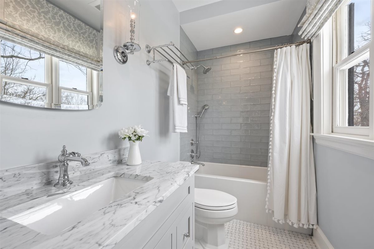 307 Abbotsford Road Kenilworth, IL 60043 - Photo 35 of 57 a bathroom with a granite countertop sink a toilet and shower