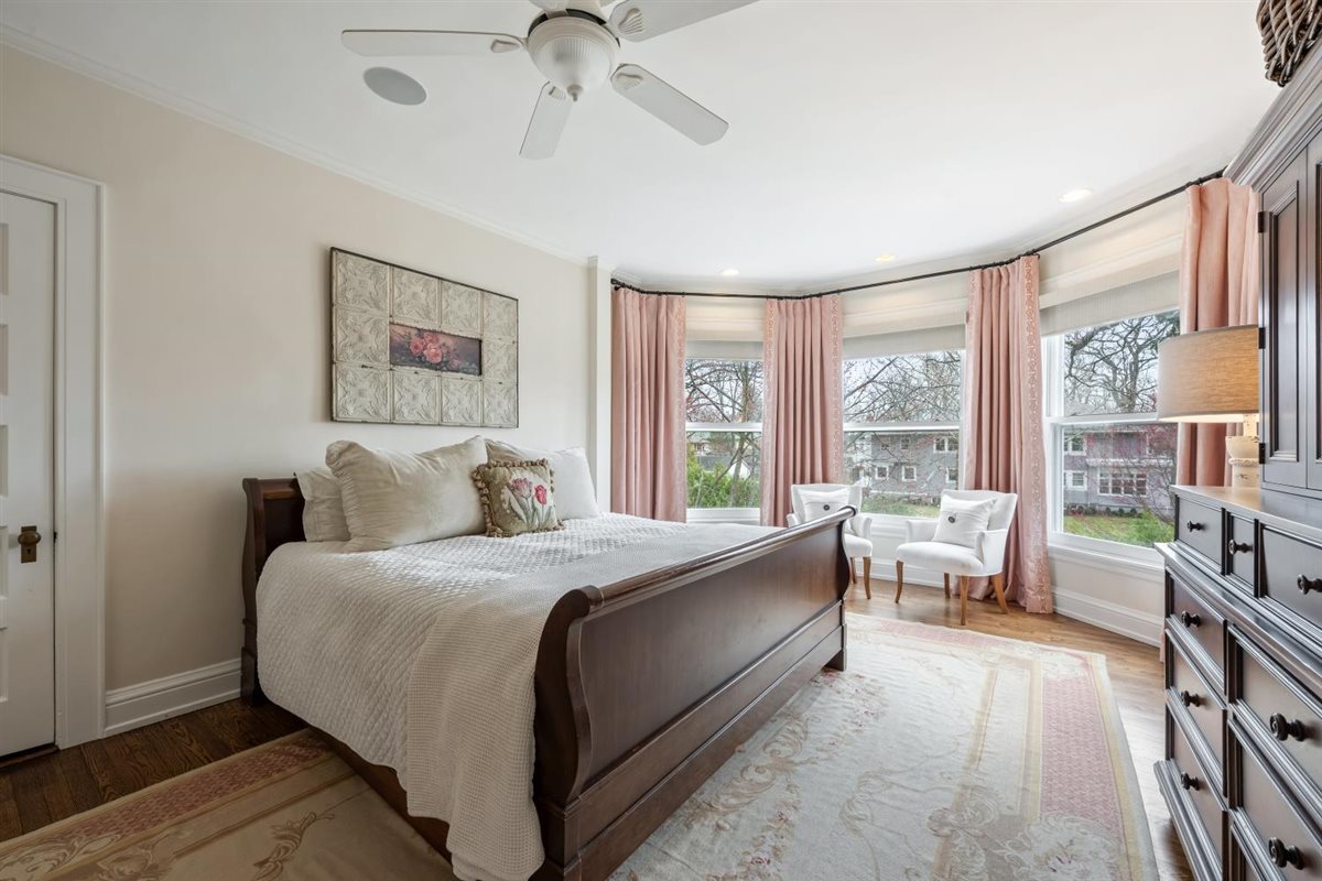307 Abbotsford Road Kenilworth, IL 60043 - Photo 36 of 57 a large bedroom with a bed and a large window