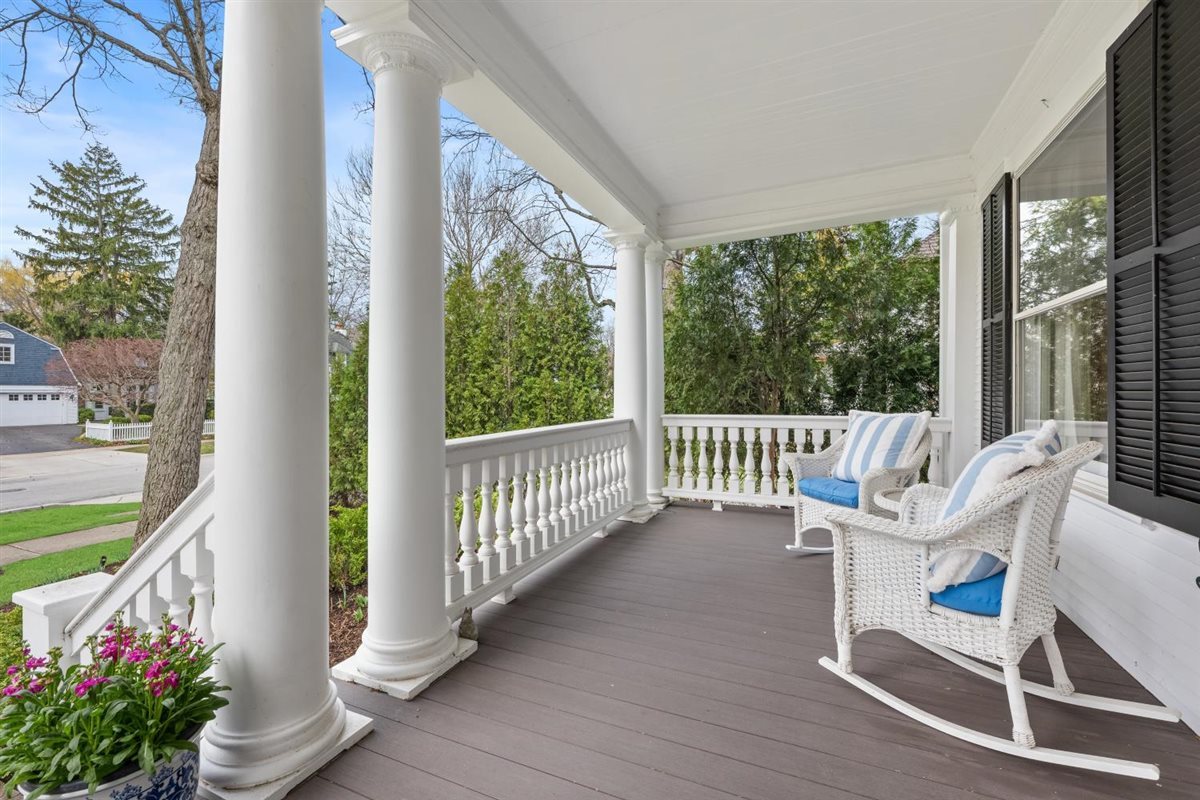307 Abbotsford Road Kenilworth, IL 60043 - Photo 4 of 57 a view of a balcony with chair and wooden floor