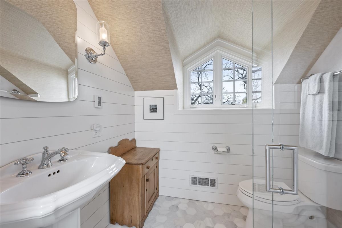 307 Abbotsford Road Kenilworth, IL 60043 - Photo 41 of 57 a bathroom with a sink mirror and toilet