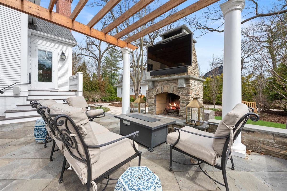 307 Abbotsford Road Kenilworth, IL 60043 - Photo 47 of 57 a dinning table and chairs in the patio of a house