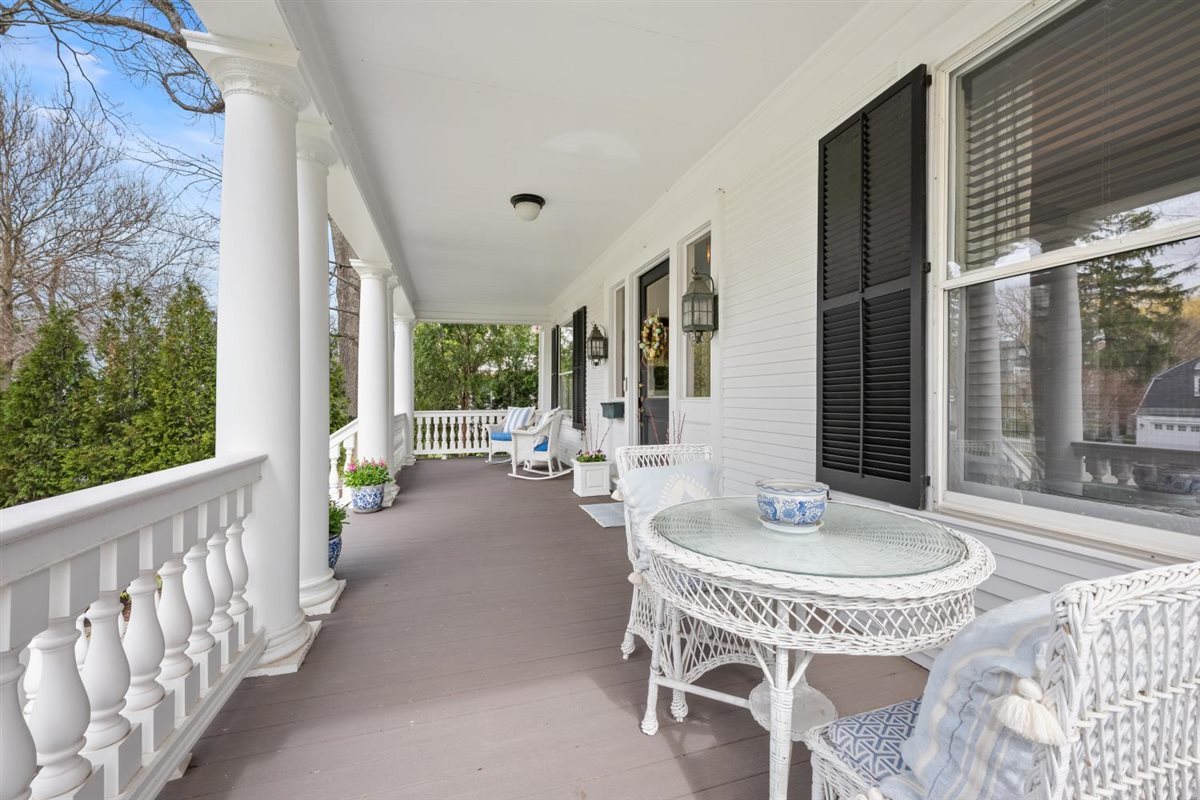307 Abbotsford Road Kenilworth, IL 60043 - Photo 5 of 57 a view of a patio with couches table and chairs and wooden floor