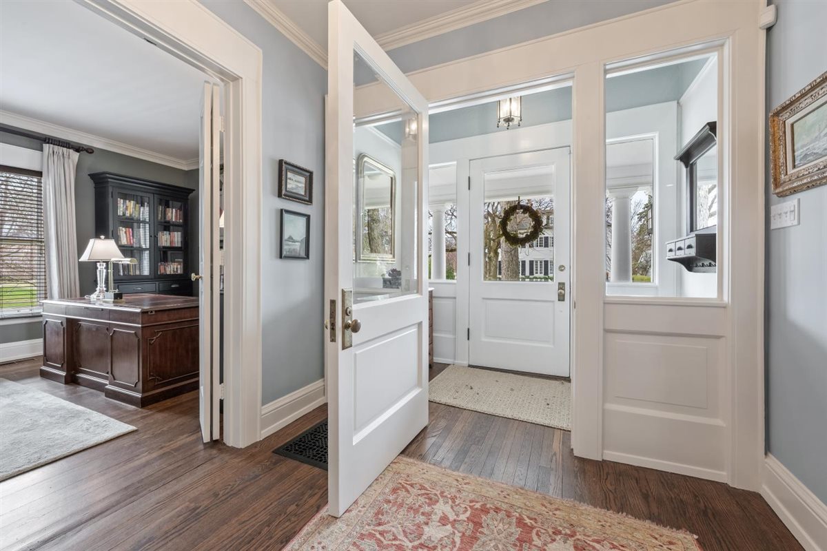 307 Abbotsford Road Kenilworth, IL 60043 - Photo 6 of 57 a hallway with wooden floor and windows