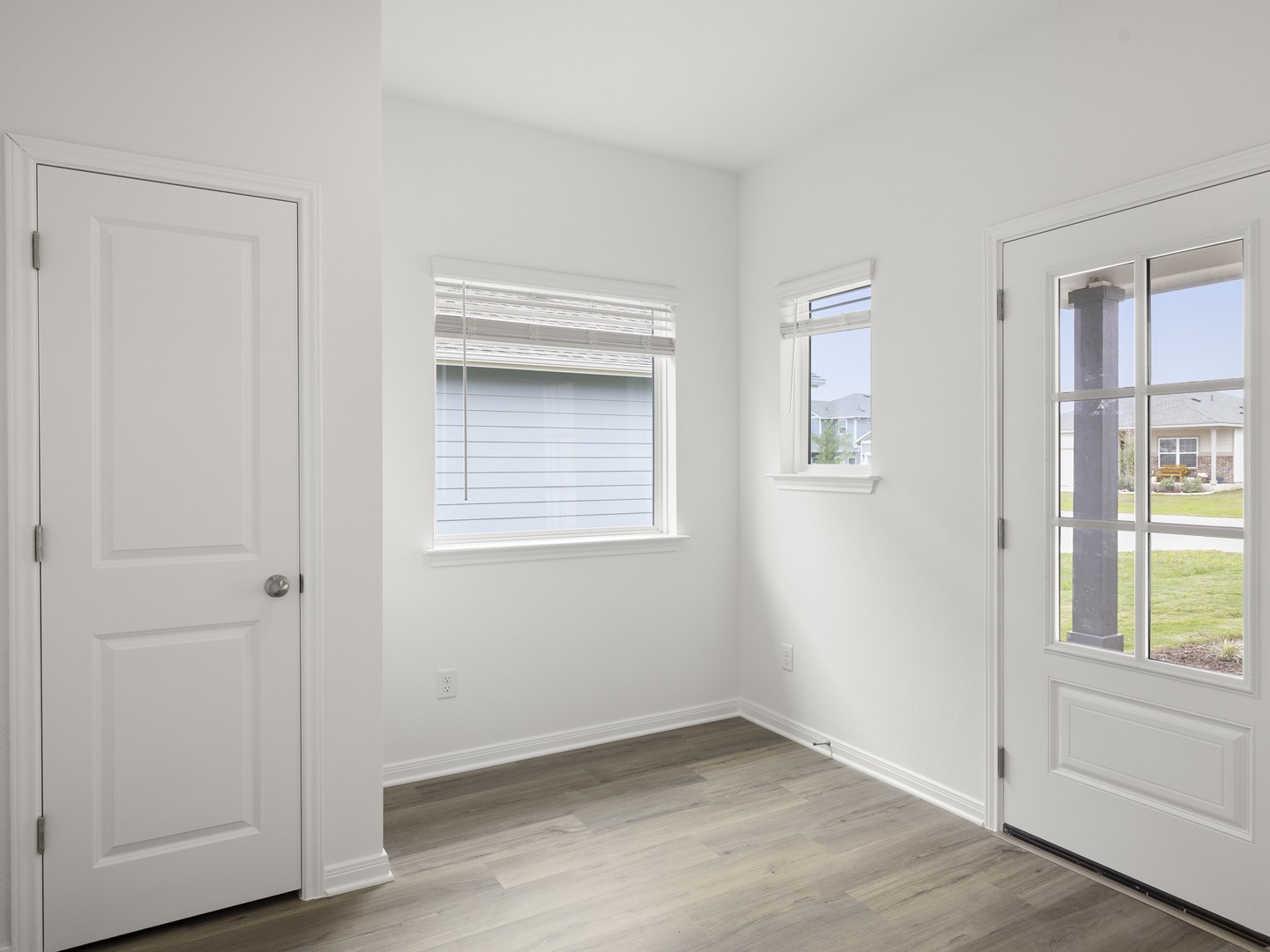 513 Yellow Ribbon Trail Jarrell, TX 76537 - Photo 4 of 23 A welcoming entry space with durable wood-look flooring and multiple windows for abundant light.