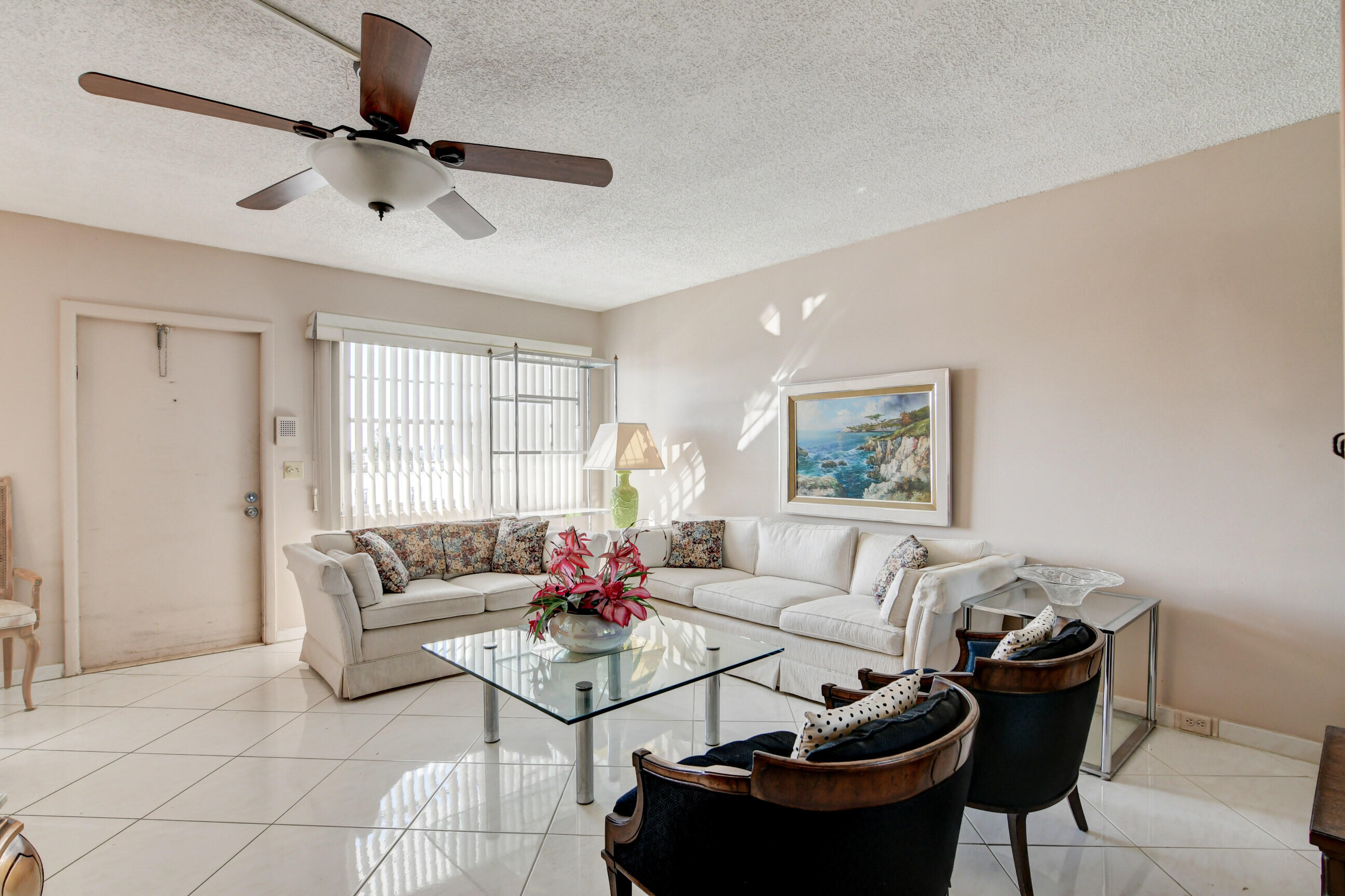 4044 Exeter C Boca Raton, FL 33434 - Photo 11 of 69 a living room with furniture and a window