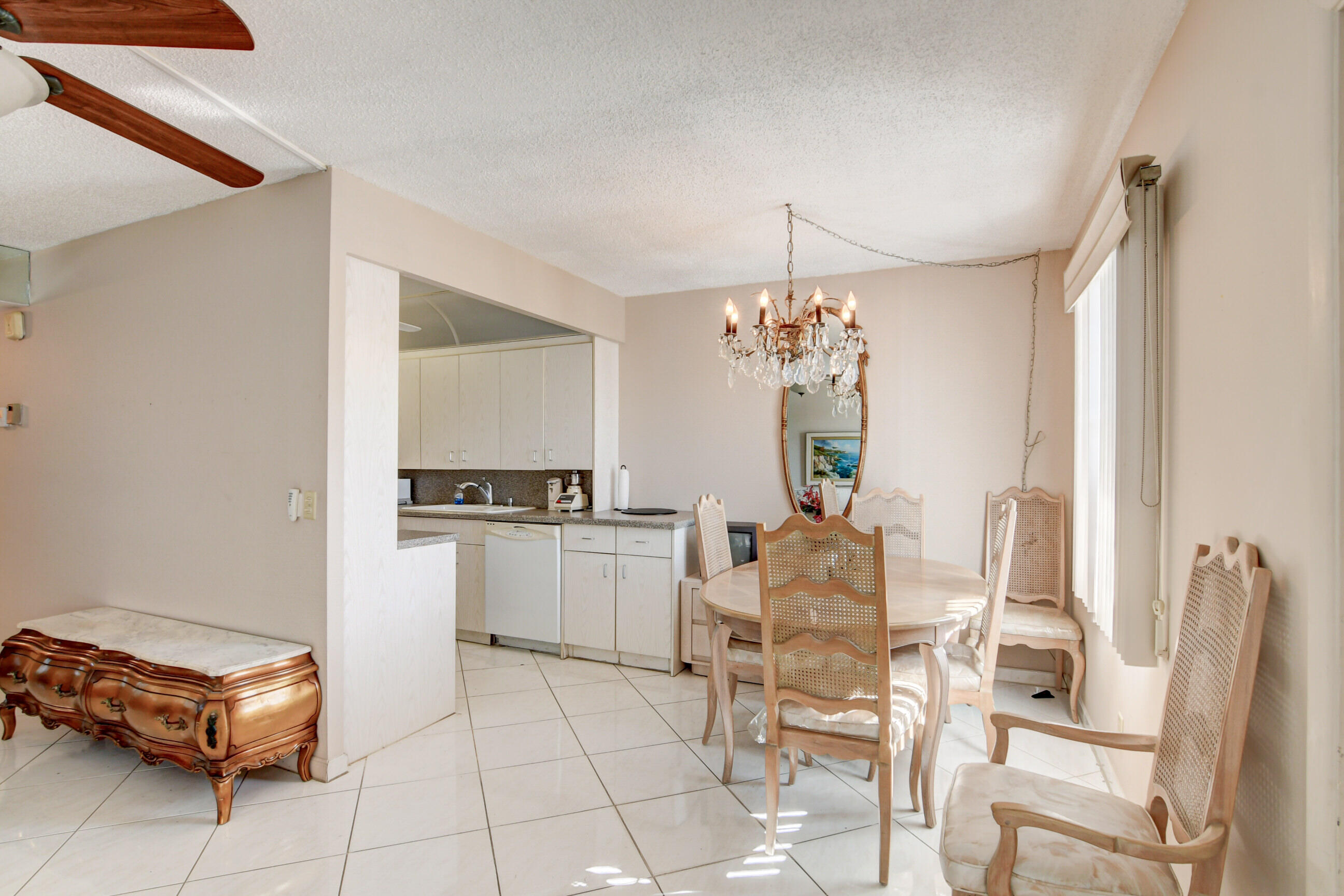 4044 Exeter C Boca Raton, FL 33434 - Photo 13 of 69 a dining room with furniture and window