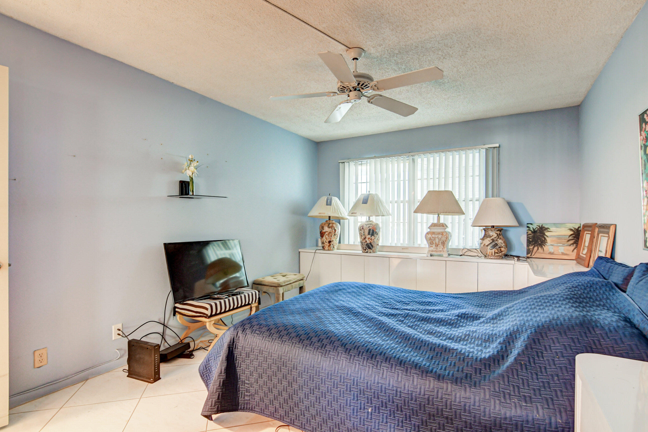 4044 Exeter C Boca Raton, FL 33434 - Photo 18 of 69 a bed room with a bed and a chair