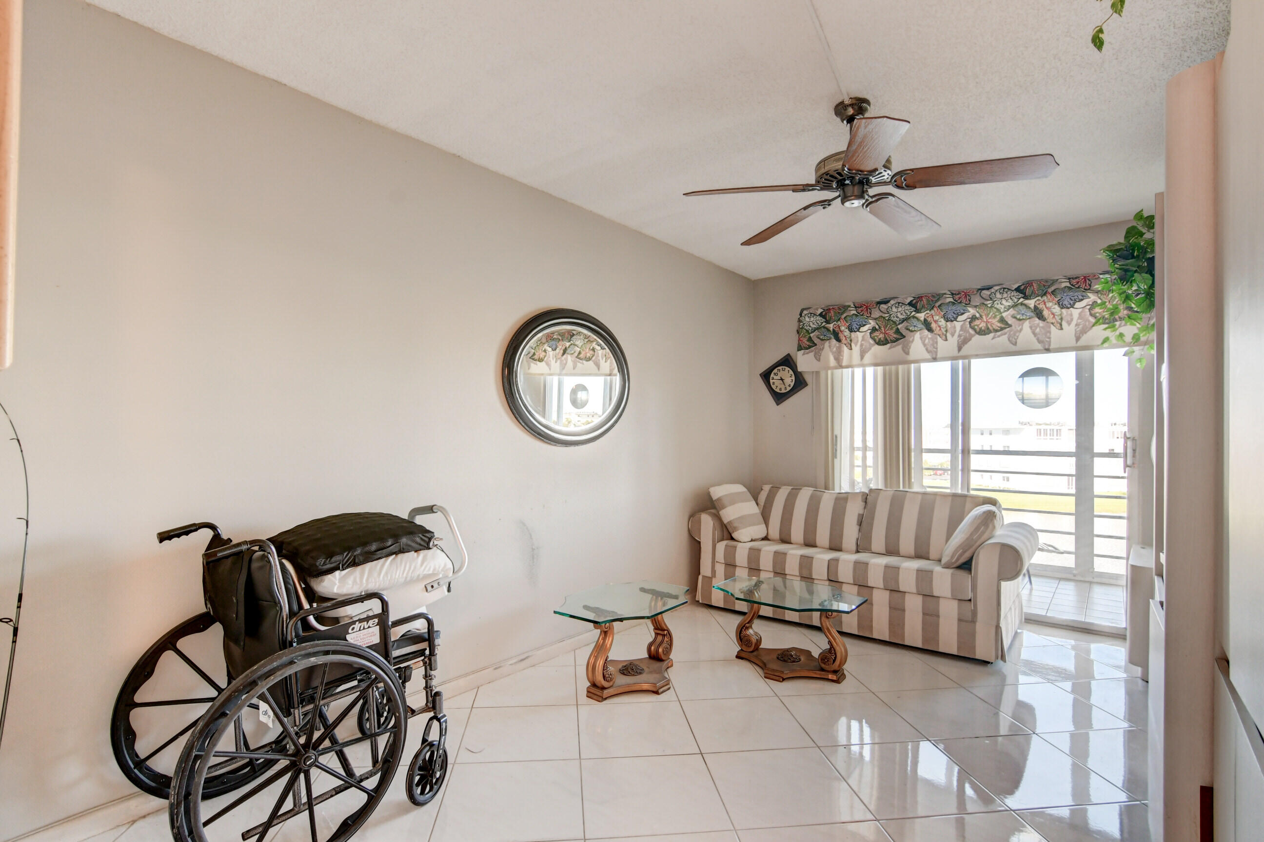 4044 Exeter C Boca Raton, FL 33434 - Photo 20 of 69 a bedroom with furniture and a window