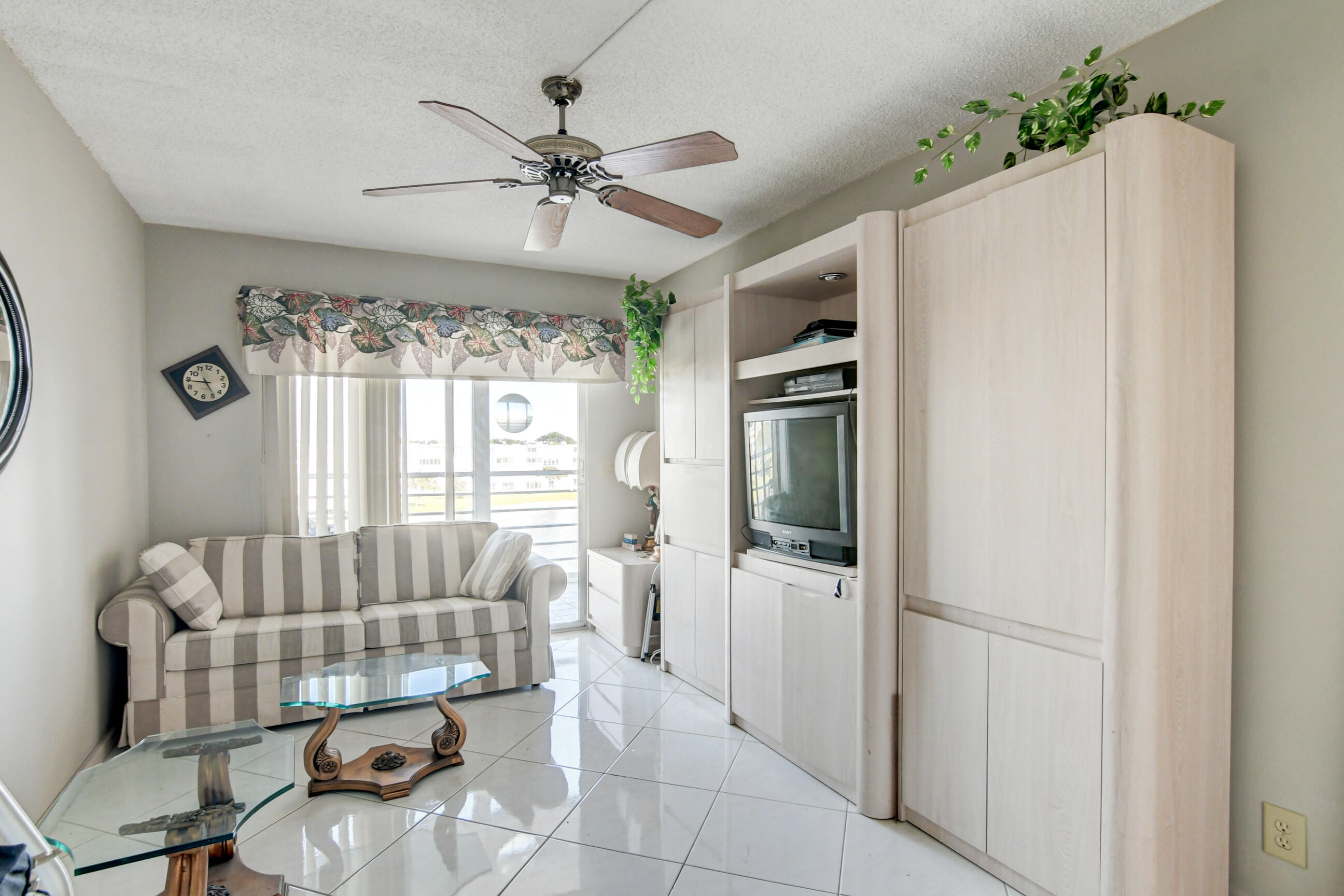 4044 Exeter C Boca Raton, FL 33434 - Photo 21 of 69 a living room with furniture and a chandelier