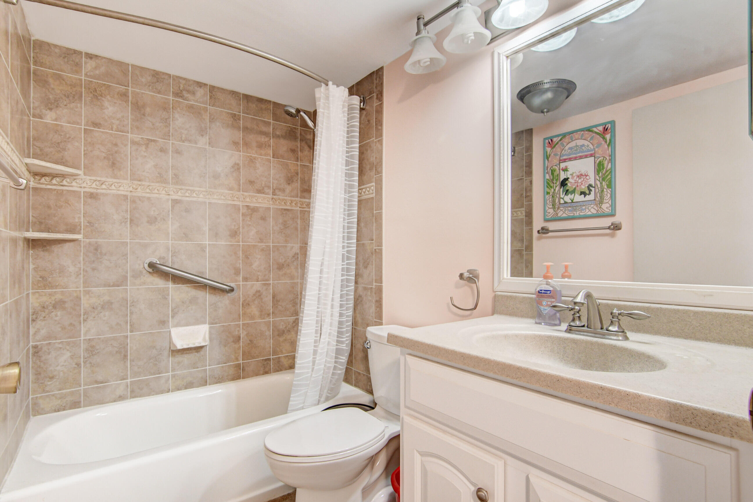 4044 Exeter C Boca Raton, FL 33434 - Photo 24 of 69 a bathroom with a granite countertop sink toilet and shower