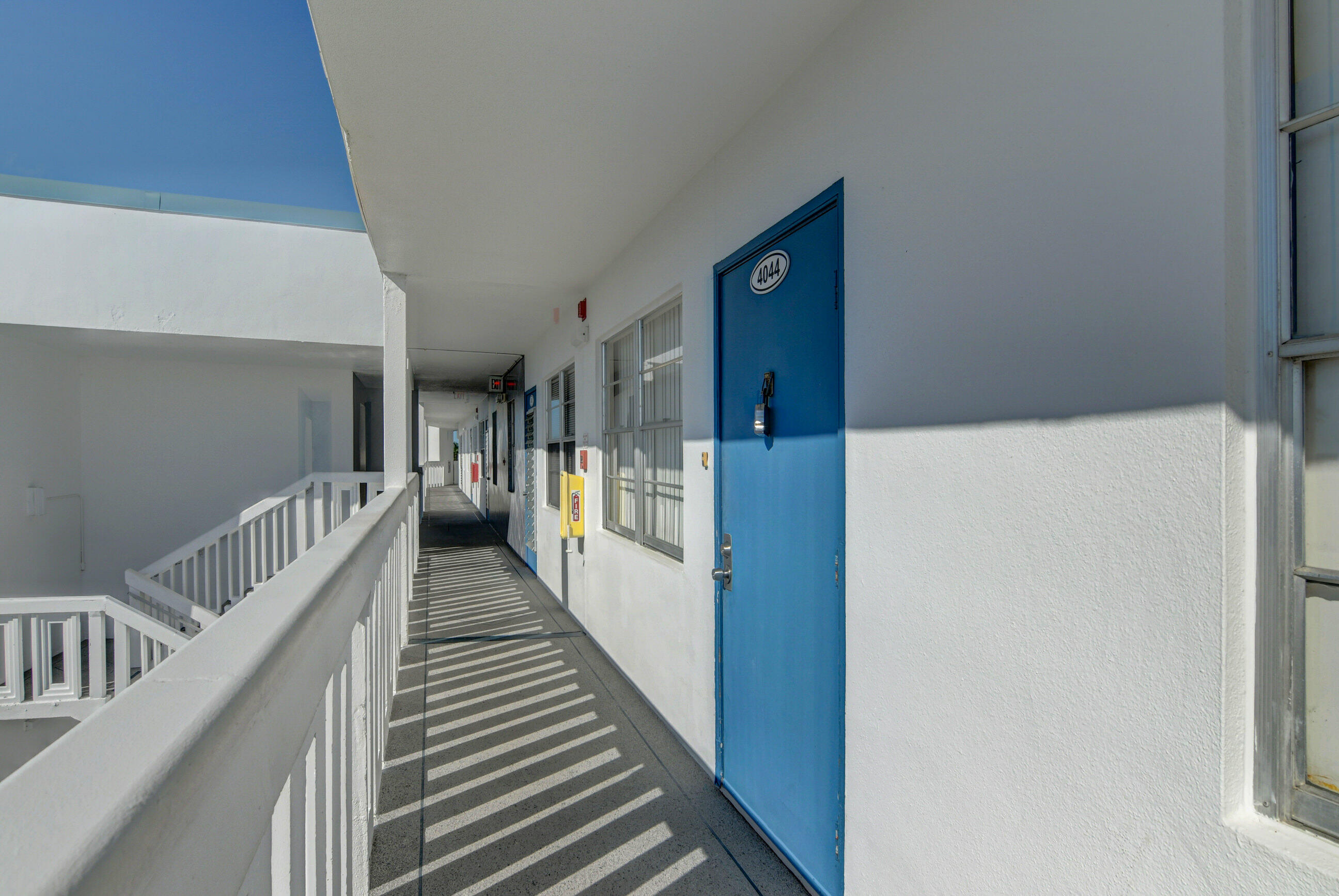 4044 Exeter C Boca Raton, FL 33434 - Photo 31 of 69 a view of a hallway with wooden floor and stairs