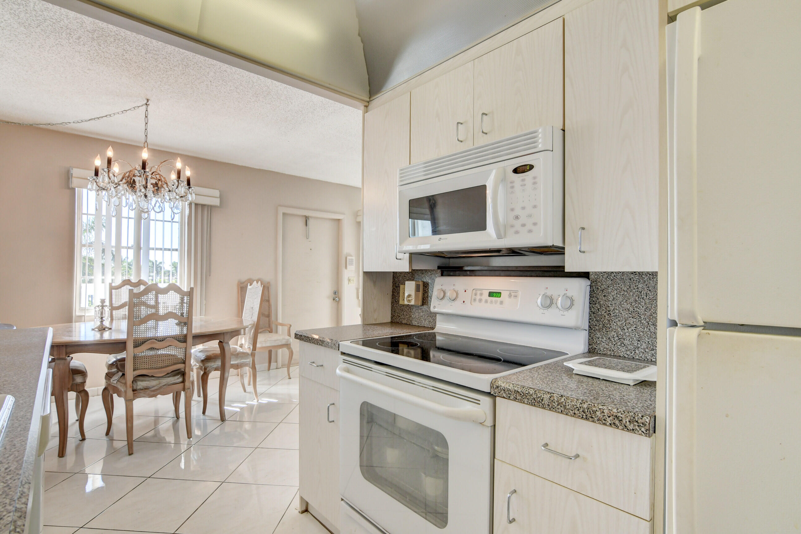 4044 Exeter C Boca Raton, FL 33434 - Photo 7 of 69 a view of kitchen with sink microwave and cabinets